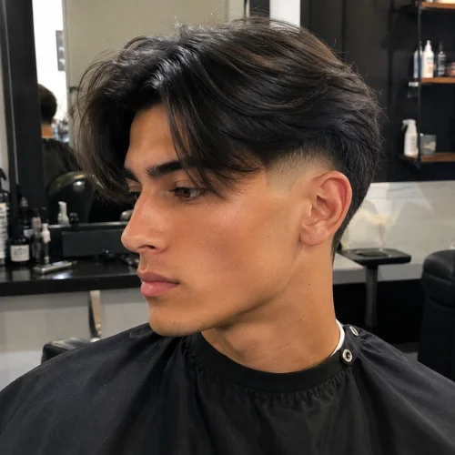 Burst fade middle part with textured curtain-style hair