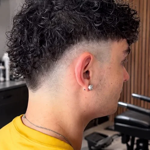 Sunburst fade with curly textured hair