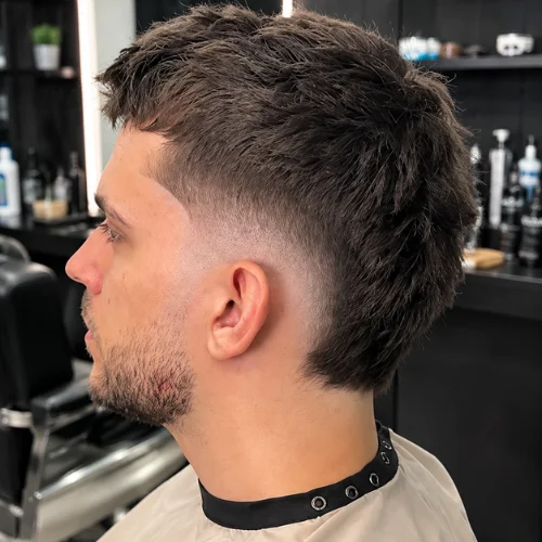 Textured burst fade with dark layered hair