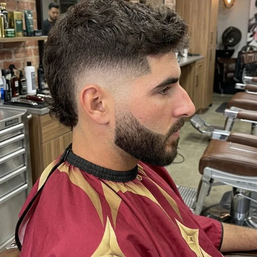 Fohawk Mullet Fade haircut with sharp beard line
